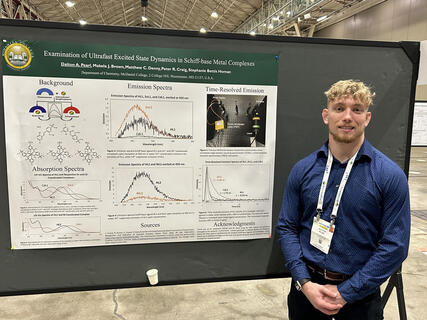 Dalton Pearl poses with his presented research poster for the ACS conference