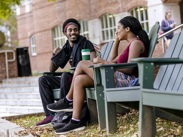 Students sitting in front of Hoover Library