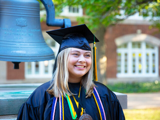 student in commencement regalia