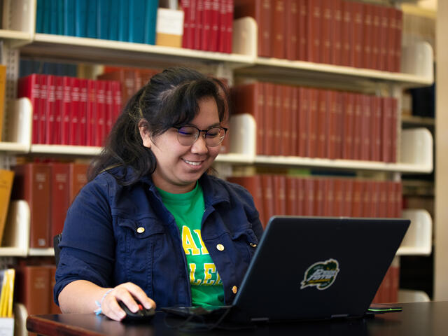 student in library