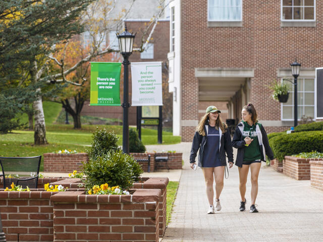 students walk on campus