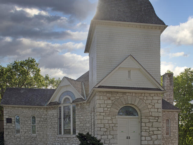 Image of Stone Church Building with tall steeple on the McDaniel College campus