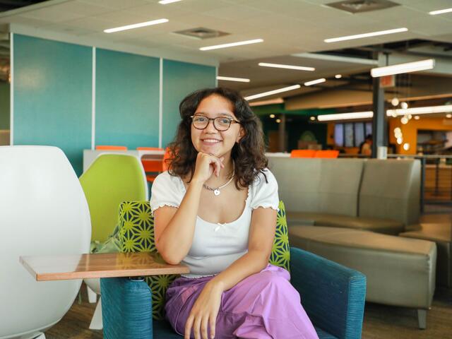 A student sitting in the student center.