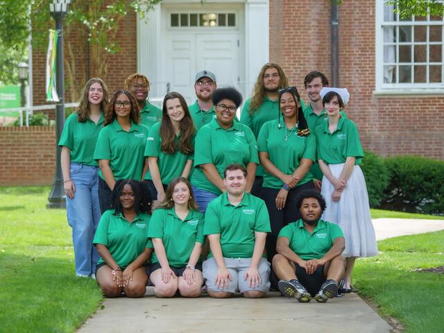 Group shot of local leaders wearing green t-shirts