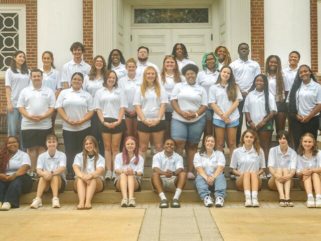 group shot of peer mentors all wearing white t-shirts