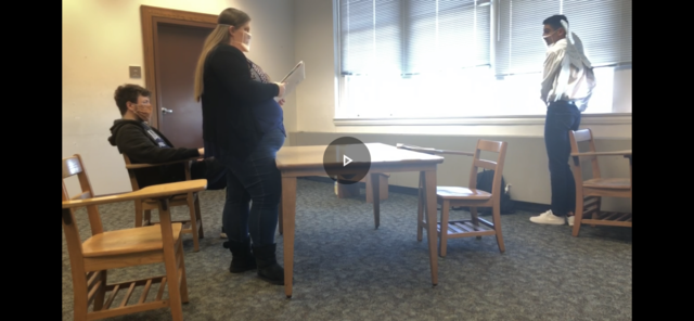 Cinema major Samuel McDermott sits in a chair with McDaniel student Julia Hurlock and McDaniel student Nick Foley portraying characters in his film “The Making of Death’s Shadow.”  