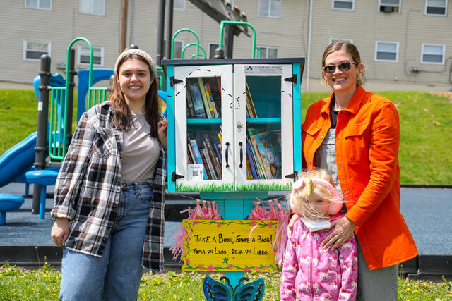 Gia K. with professor Chloe Irla at the new little free library on Charles Street.