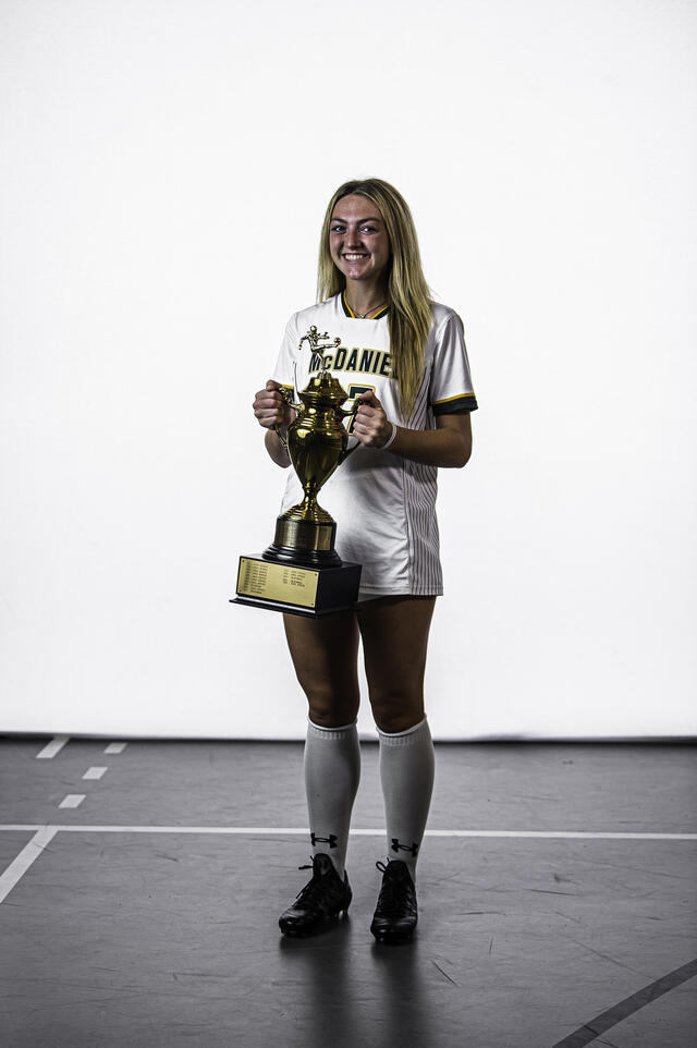 Lauren Murray '22 with the 2021 Centennial Conference Championship trophy for women's soccer.