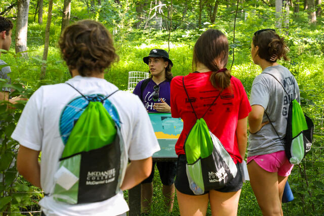 Students listening to a guide on the MEC nature tour.