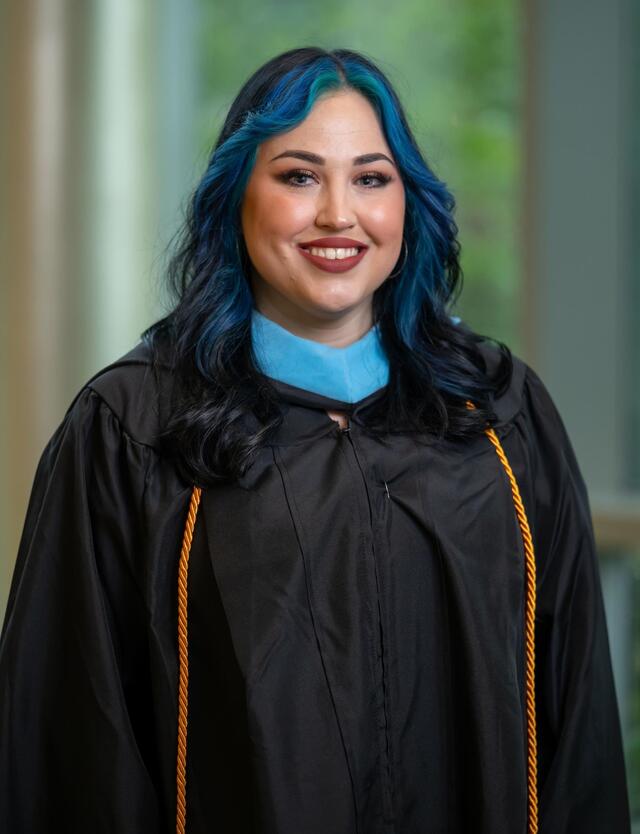 Headshot of Brittany Pierce in graduation regalia.