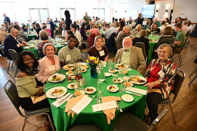 group of people pose at formal event