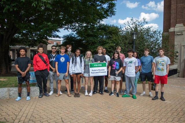 students with FYS sign