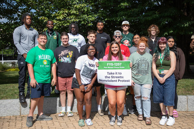 group of students with sign