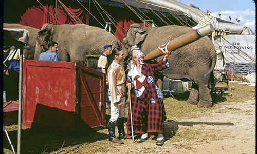 Clown (Lou Jacobs) and Performer (Oscar Cristiani) with a Big Cigar, August 12, 1941, Ringling Brothers and Barnum & Bailey Circus. Photo by Sverre O. Braathen. Courtesy of the Milner Library at Illinois State University.