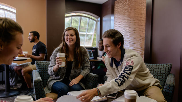 Students in conversation at Casey's Corner.