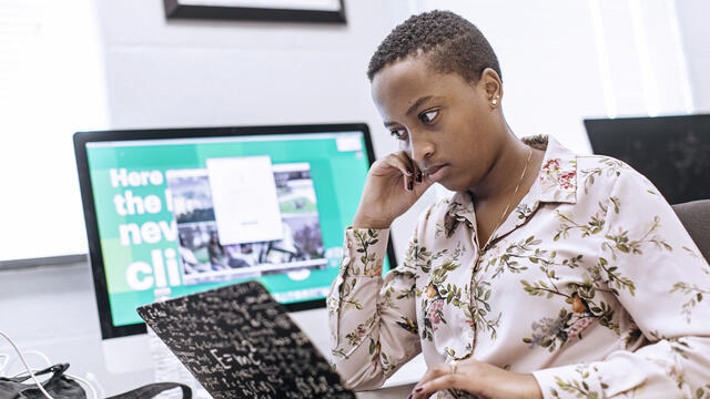 Student using a computer in a computer lab.