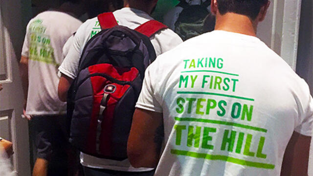 Picture of the back of a t-shirt that reads: Taking My First Steps on the Hill