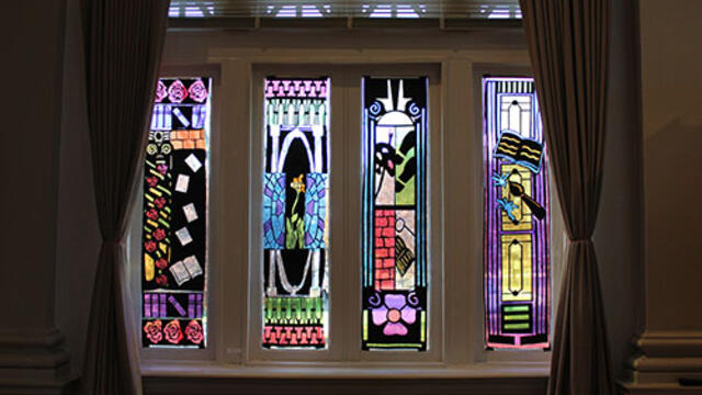 Photo of stained glass panels created by students for "Views of McDaniel" art exhibition