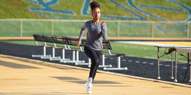 Student running on track